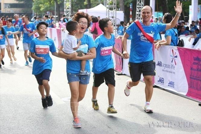 Niềm vui của các Bet88.Com Link Nhà Cái Bet88 BMXCT Uy Tín tham dự “Giải chạy Family Ekiden 2024 - Cung đường tiếp sức cả nhà cùng vui” khi về đích. Ảnh: Thành Đạt - TTXVN