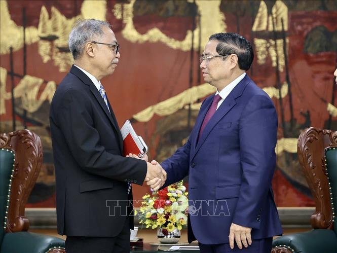 Thủ tướng Phạm Minh Chính  tiếp ông Adam Mulawarman Tugio, Đại sứ Đặc mệnh toàn quyền Cộng hòa Indonesia tại Việt Nam. Ảnh: Dương Giang-TTXVN 